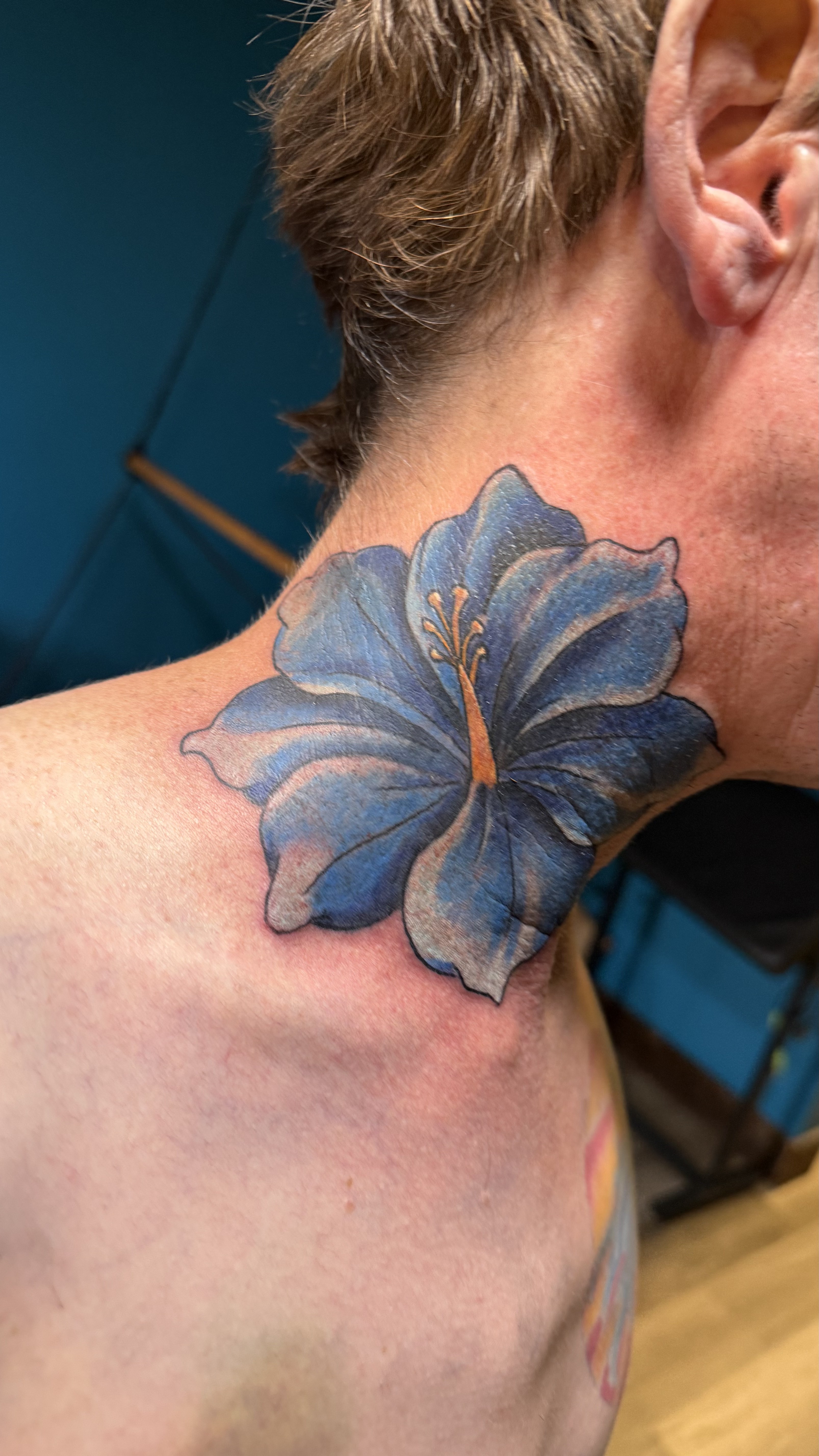 Blue flower tattoo
